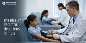 Doctor checking blood pressure of school children – Rise of Pediatric Hypertension in India – Adhikari Lifeline Hospital